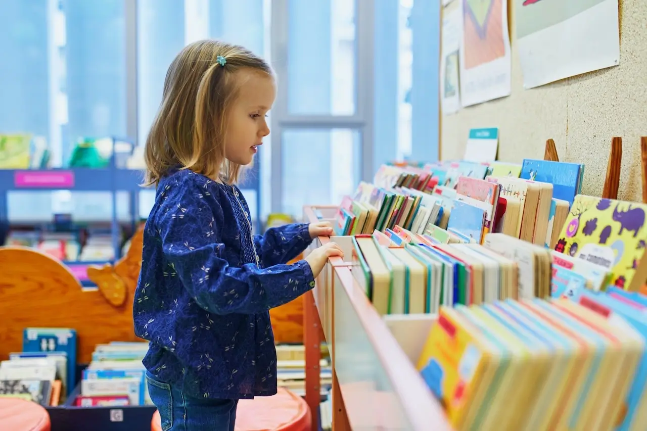 Child Picking out a book